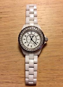 J12 Chanel watch with an after market 33 diamond bezel (Used)