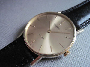 vintage 14k solid yellow gold Movado quartz With 14k solid gold buckle/ NOS band