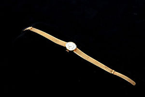 A wonderful antique 18K gold Swissmade SOFIOR GREY lady watch