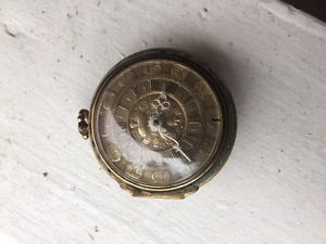 old pocket watch with silver dial