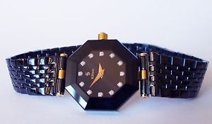 H STERN "Safira" 12 diamond and 18K Gold Quartz Watch. 23mm Blue Sapphire Dial.