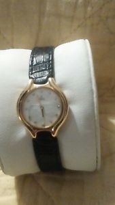 18k yellow gold ebel beluga woman's watch with diamond & white pearlized face.