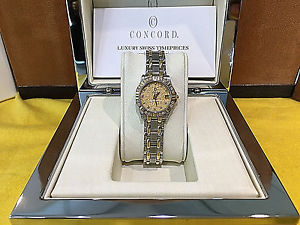 Ladies Concord Saratoga SL & 18K Yellow Gold Diamond Bezal & Diamond Dial Watch.
