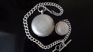 Silver antique pocket watch with silver chain.
