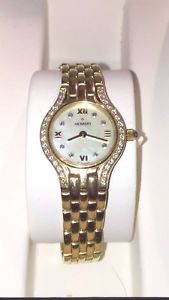 LADIES MOVADO 14KT GOLD DIAMOND SAPPHIRE CRYSTAL WATCH MOP FACE WATER RESISTANT