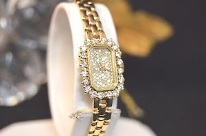 LADIES 14K YELLOW GOLD WHIT 1.7 CARAT DIAMOND DIAL AND BEZEL WATCH.