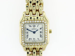 Ladies Movado 14Kt Yellow gold and Diamond bezel watch