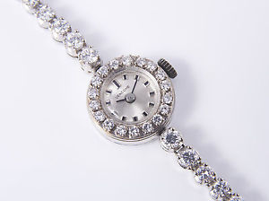 TENNIS- ARMBAND UHR voll ausgefasst mit 4,00 Carat BRILLANTEN / weiß GOLD 750