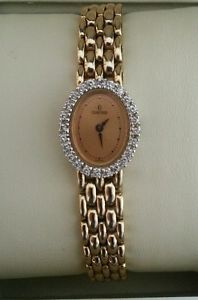 Ladies 14K Gold Concord Watch with Diamond Bezel and Oval Face