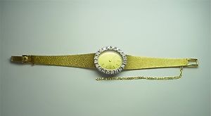 18K 2-TONE GOLD LADY'S JUVENIA WATCH W/ DIAMOND BEZEL AND 18 KT Y/ GOLD BRACELET