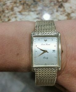 Lucien piccard mens solid 14k gold watch rectangle face.