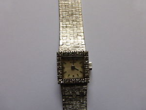 Montre Movado or gris 18 carats, et véritables diamants année 1967