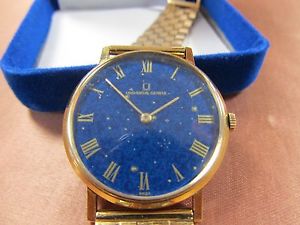 VINTAGE MENS 18 KT. UNIVERSAL GENEVE  DRESS WRIST WATCH /WITH 14 KT GOLD BAND