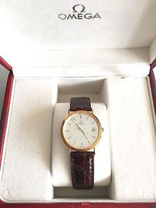OMEGA SWISS UNISEX WATCH. 18 K GOLD.  NEW!