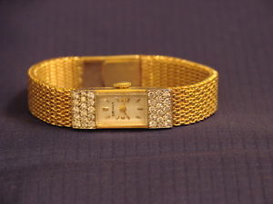One lady's 14 k yellow gold Diamond dress watch, 34.76 grams. Cresaux movement.