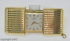 Reiseuhr Gold Uhr in 750 Gold Handaufzug Marke Movado Herrenuhr Marken Uhren