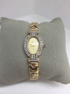Ladies Yellow Gold and Diamond Geneve watch.