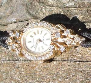 Ladies 14Kt Yellow Gold Geneve Watch w/ 1.00 Kt Diamond Bezel & Diamond Lugs