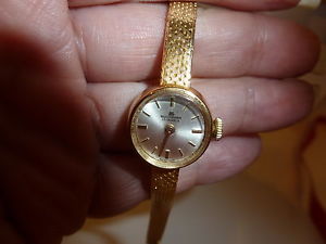 Luxury 18k gold ladies Bucherer dress watch with gold mesh band