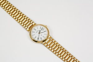 Massiv goldene Damenuhr, 585/ Quarzwerk mit Datum; Gewicht 49,4 Gramm, 18 cm