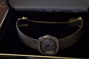 Benjamin and Associates 14 Karat Gold Watch