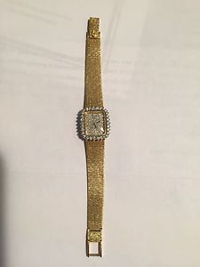 18K yellow gold Concord Watch and Bracelet.