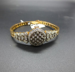 Lady watch brand CYMA in gold and diamonds