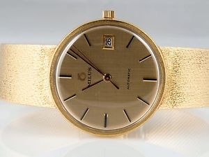 MILUS HERREN ARMBAND UHR / AUTOMATIK / 750 GOLD / ca. 75,30 Gramm
