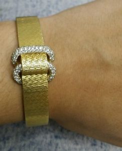 Movado women's braclet watch 18k yellow gold