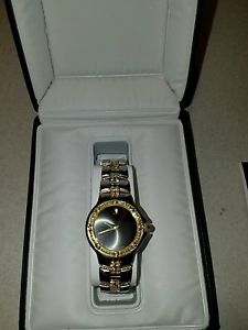 Ladies Movado watch SS gold with factory diamonds